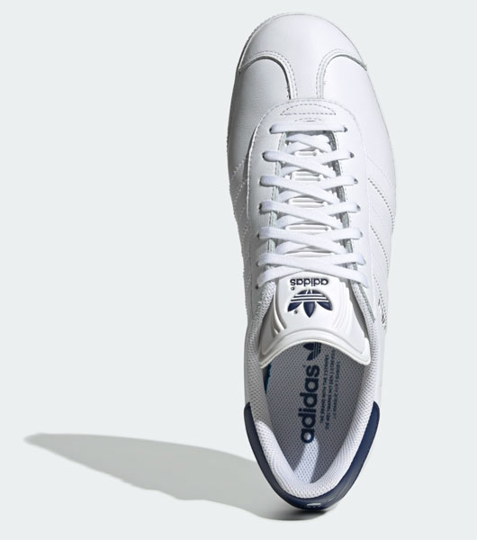 white and navy gazelle trainers
